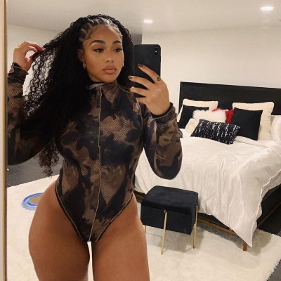 Jordyn Woods Poses for a Mirror Selfie in Camo Bodysuit