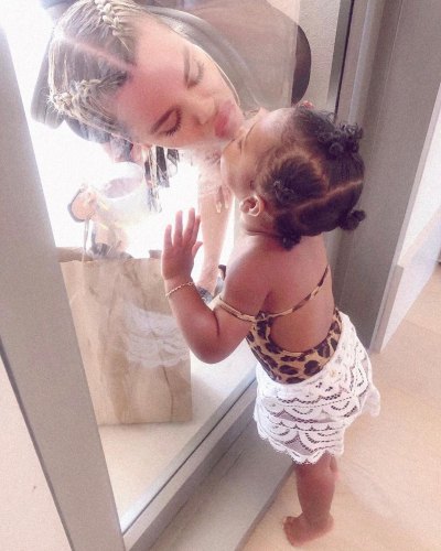 Khloe Kardashian Kisses True Thompson Through Glass Door