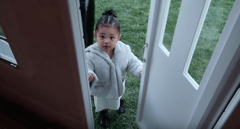 Stormi Webster Stands in Dollhouse Front Door Christmas Gift From Kris Jenner