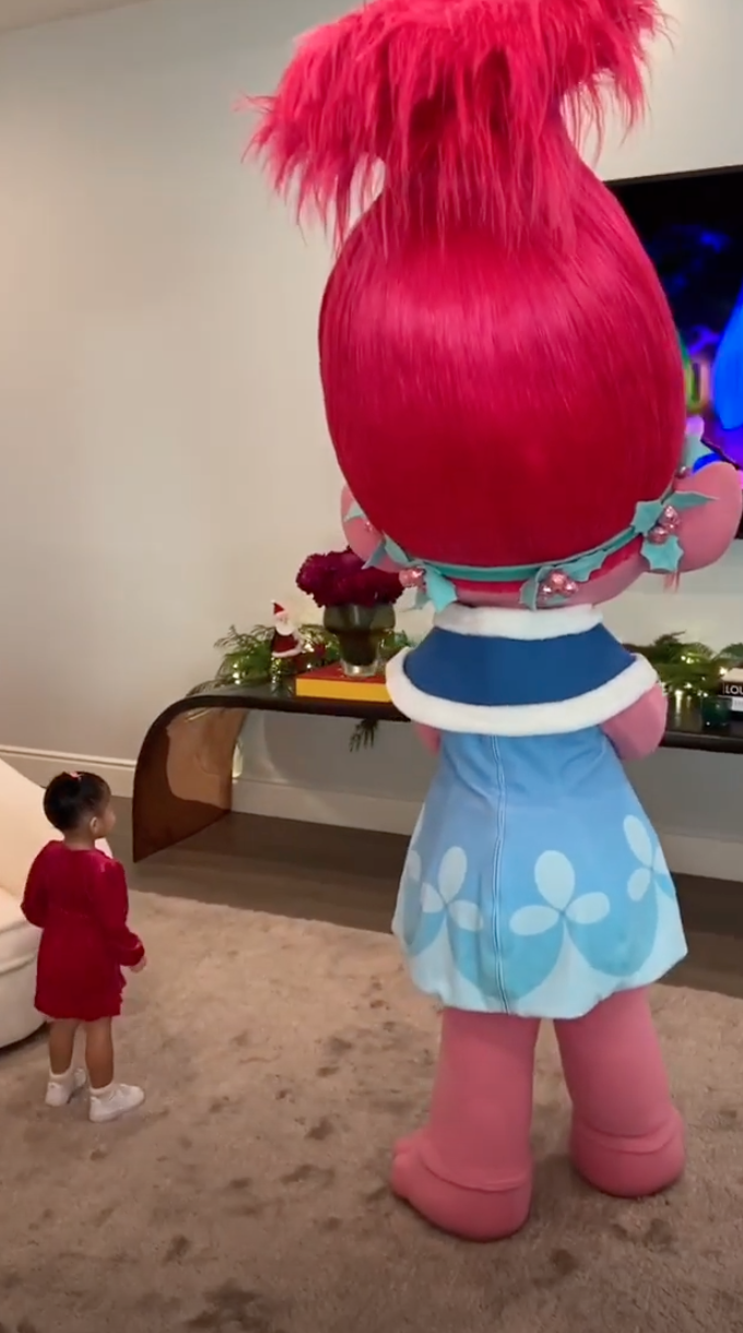 Stormi With Poppy Watching Trolls