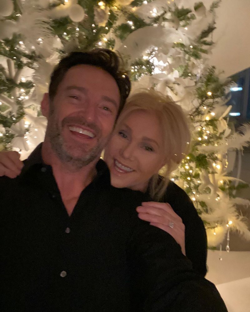 Hugh Jackman and His Wife by the Christmas Tree