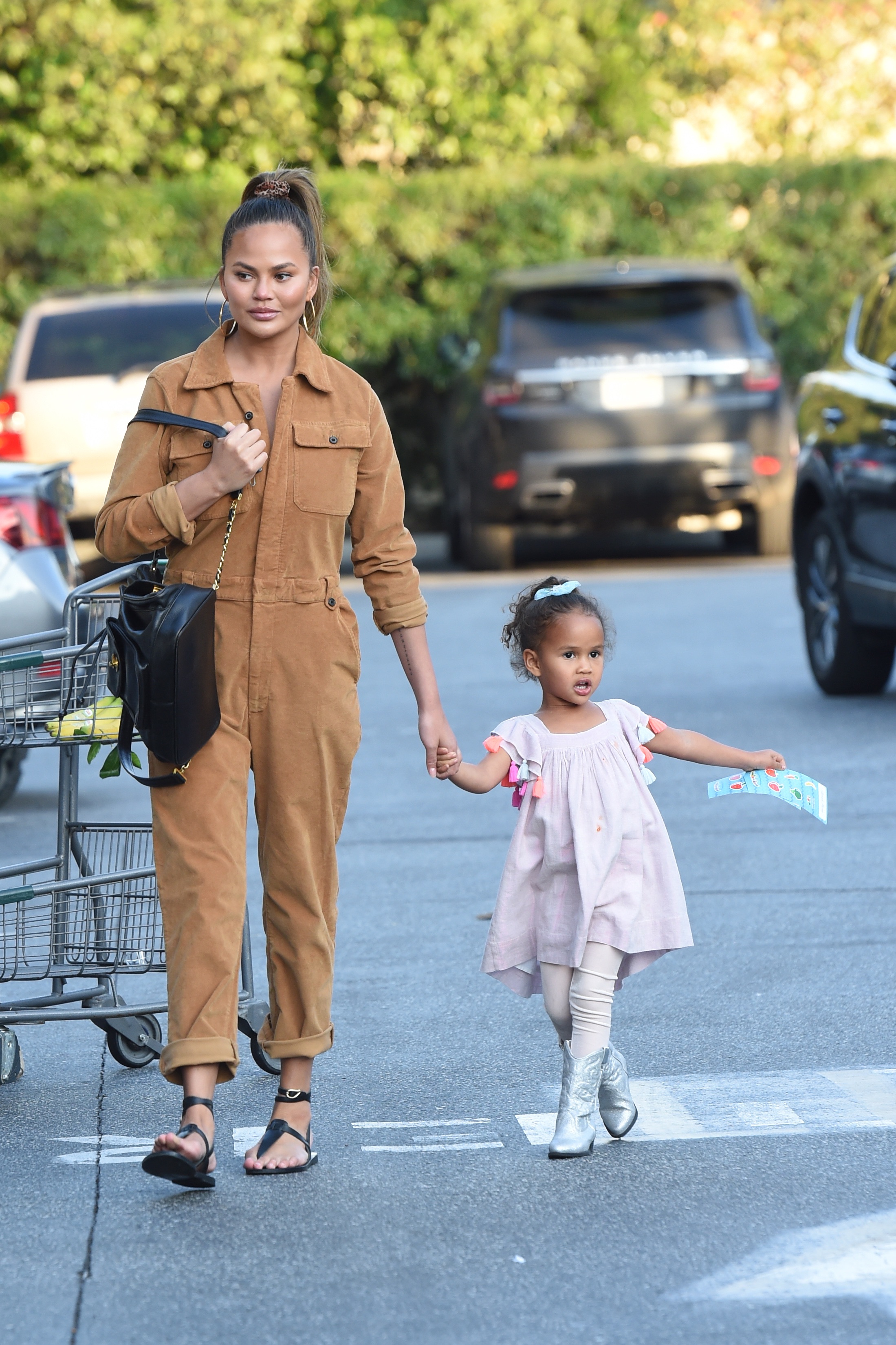 Chrissy Teigen and her daughter Luna go grocery shopping at Bristol Farms
