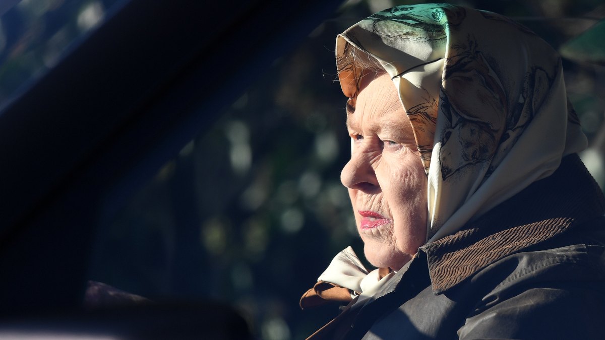 The Queen drives through Sandringham