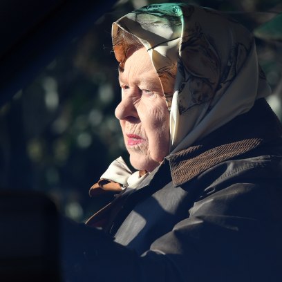 The Queen drives through Sandringham