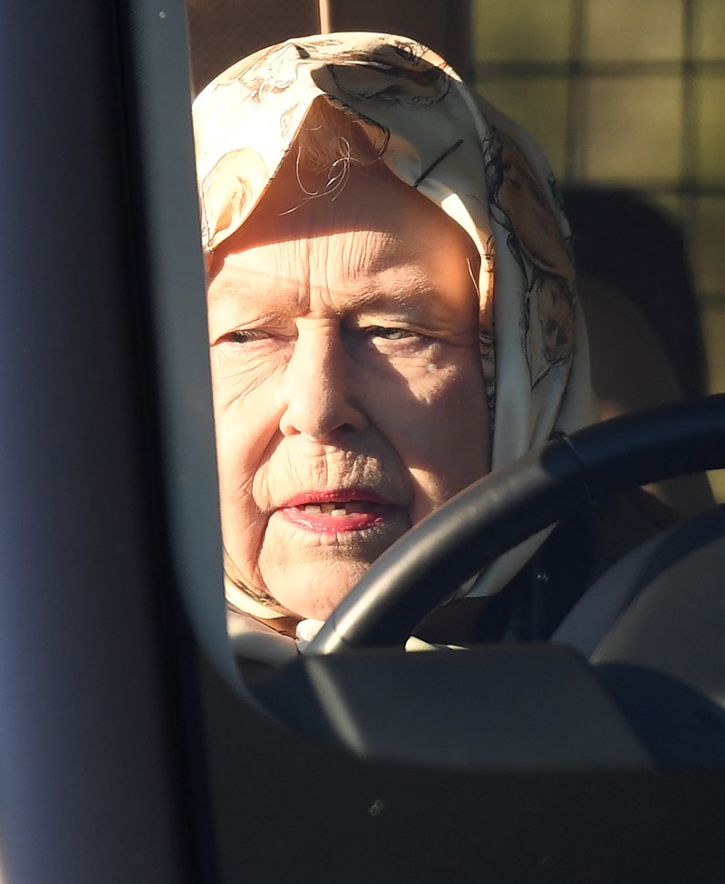 The Queen drives through Sandringham