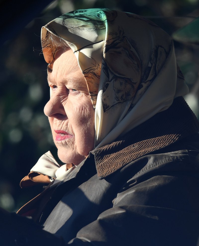 The Queen drives through Sandringham