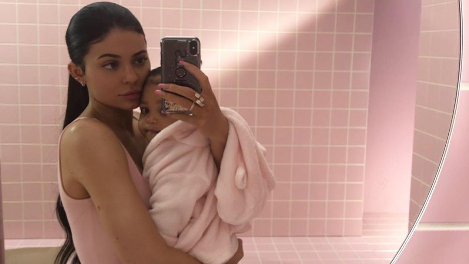 Kylie Jenner Holding Stormi Webster in a Pink Bathroom