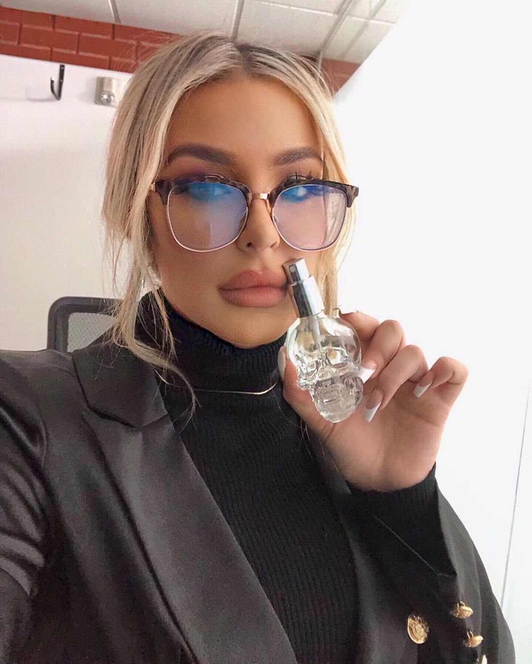 Tana Mongeau Holding Tana By Tana Perfume