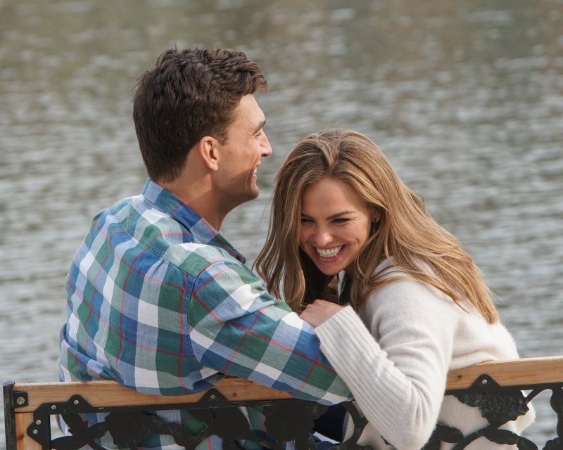 Bachelorette Tyler Cameron Wears a Plaid Shirt and Sits on a Bench With Hannah Brown Laughing