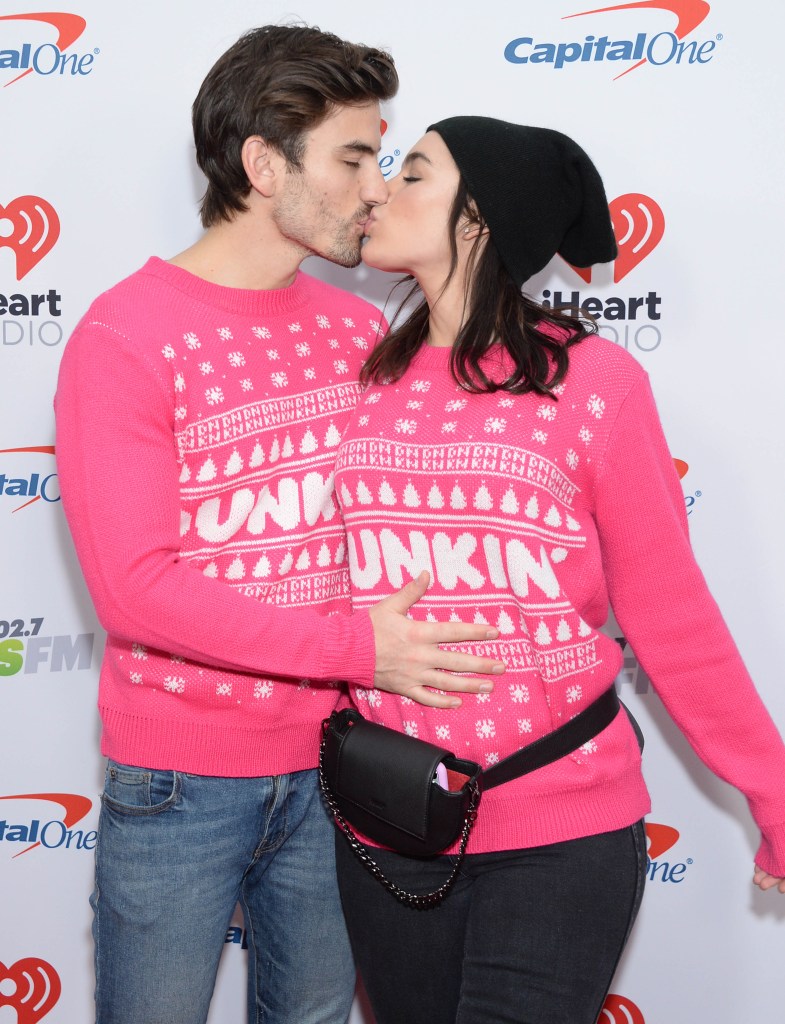 Ashley Iaconetti and Jared Haibon Wearing Pink Sweaters and Kissing