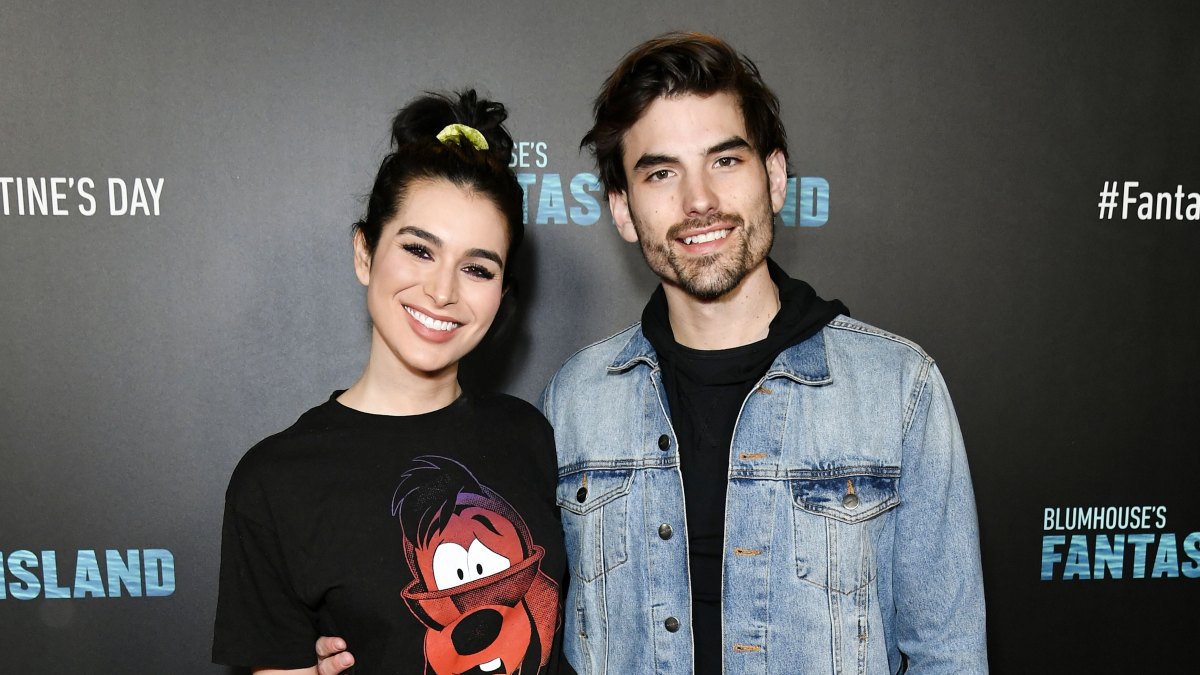 Ashley Iaconetti Wearing a Black t-Shirt With Jared Haibon at a Premiere