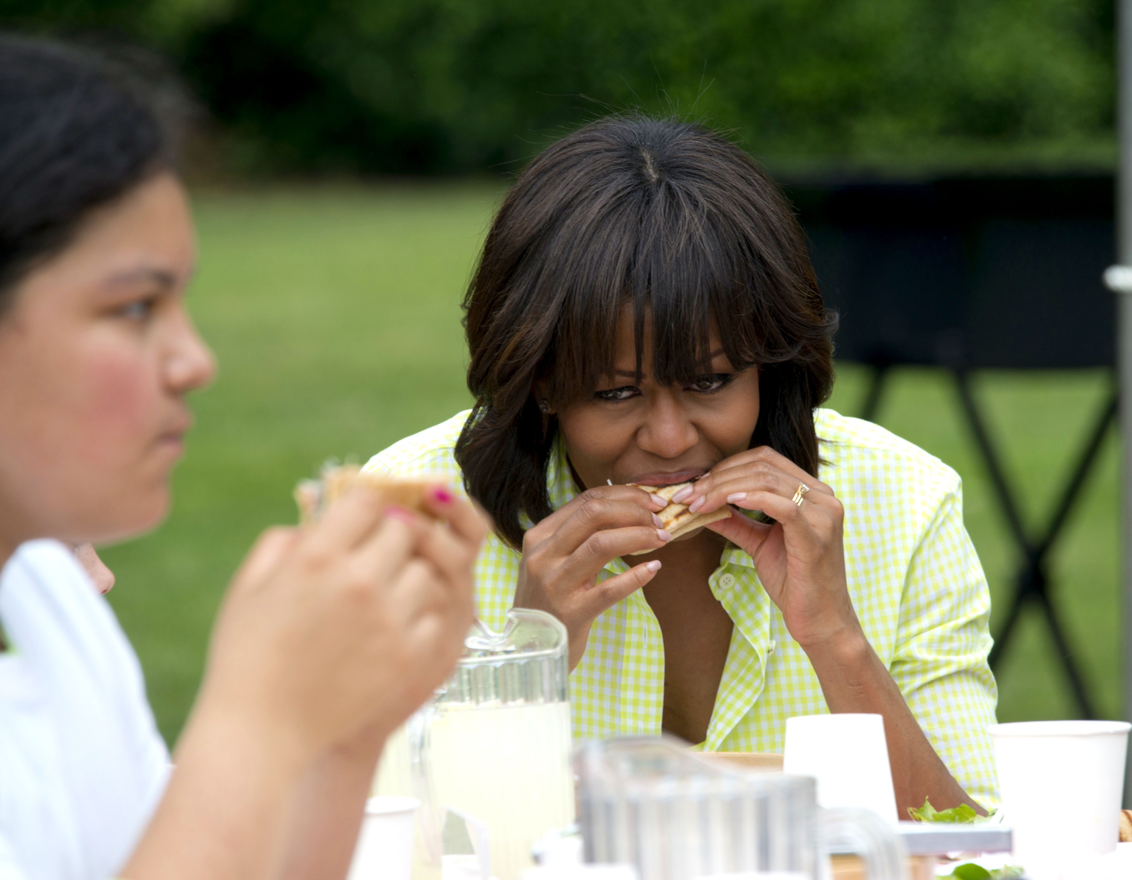 Michelle Obama Eating a Pizza
