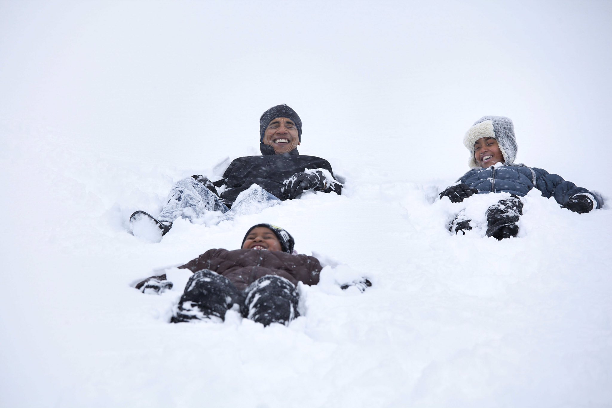 Michelle Obama Shares Photo of Husband Barack and Daughters in the Snow