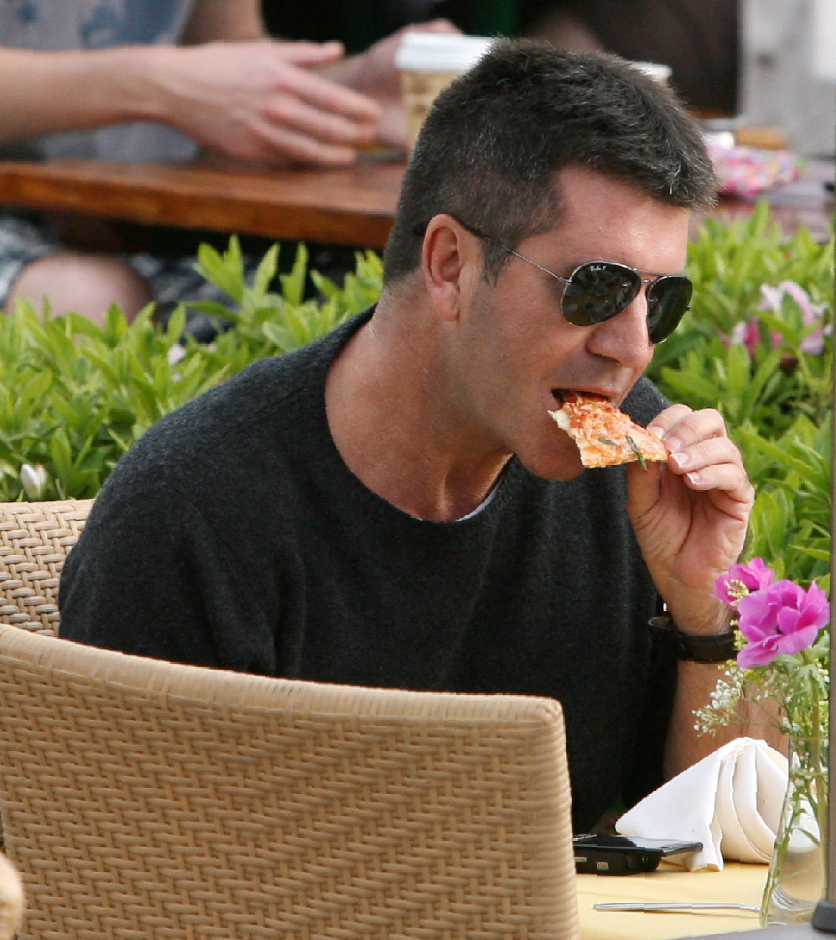 Simon Cowell Eating a Pizza