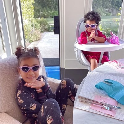 North West and Cousin True Thompson Wear Sunglasses While Praying at the Table