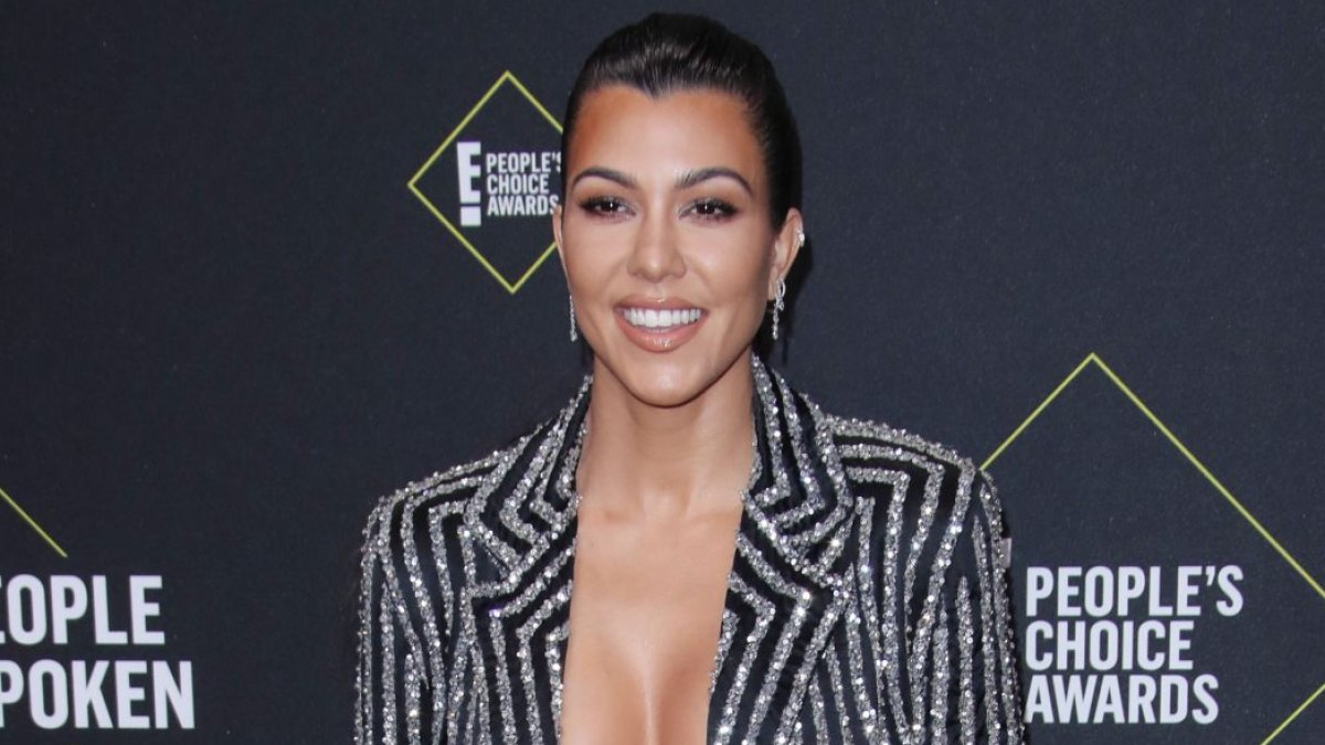 Kourtney Kardashian Wears Backless Dress in Her Kitchen