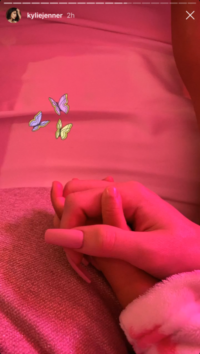 kylie-jenner-stormi-webster-hold-hands-bed