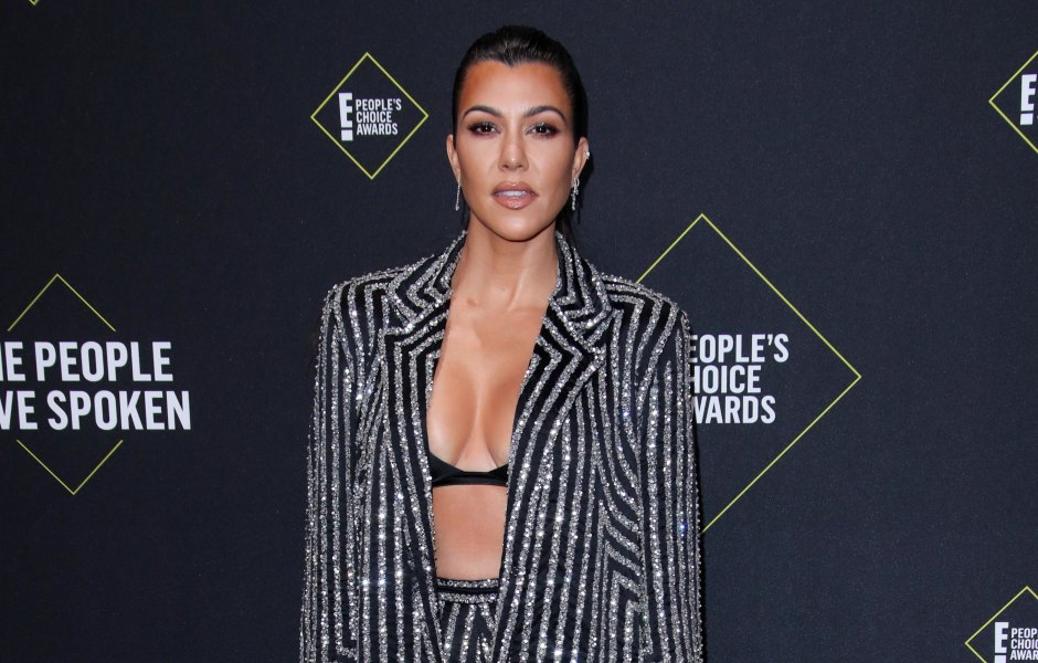 Kourtney Kardashian Wears Sparkly Pinstripe Suit With Black Bra Top and Hair Slicked Back