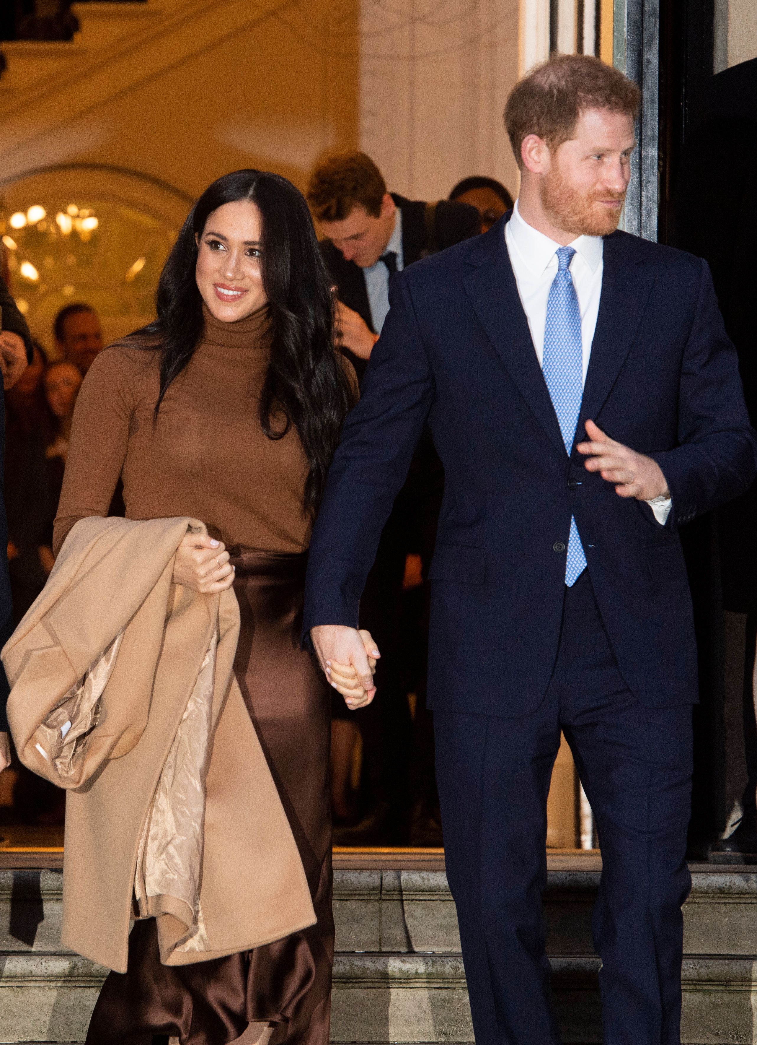 Meghan Markle Smiles in Brown Outfit With Prince Harry in Suit Holding Hands