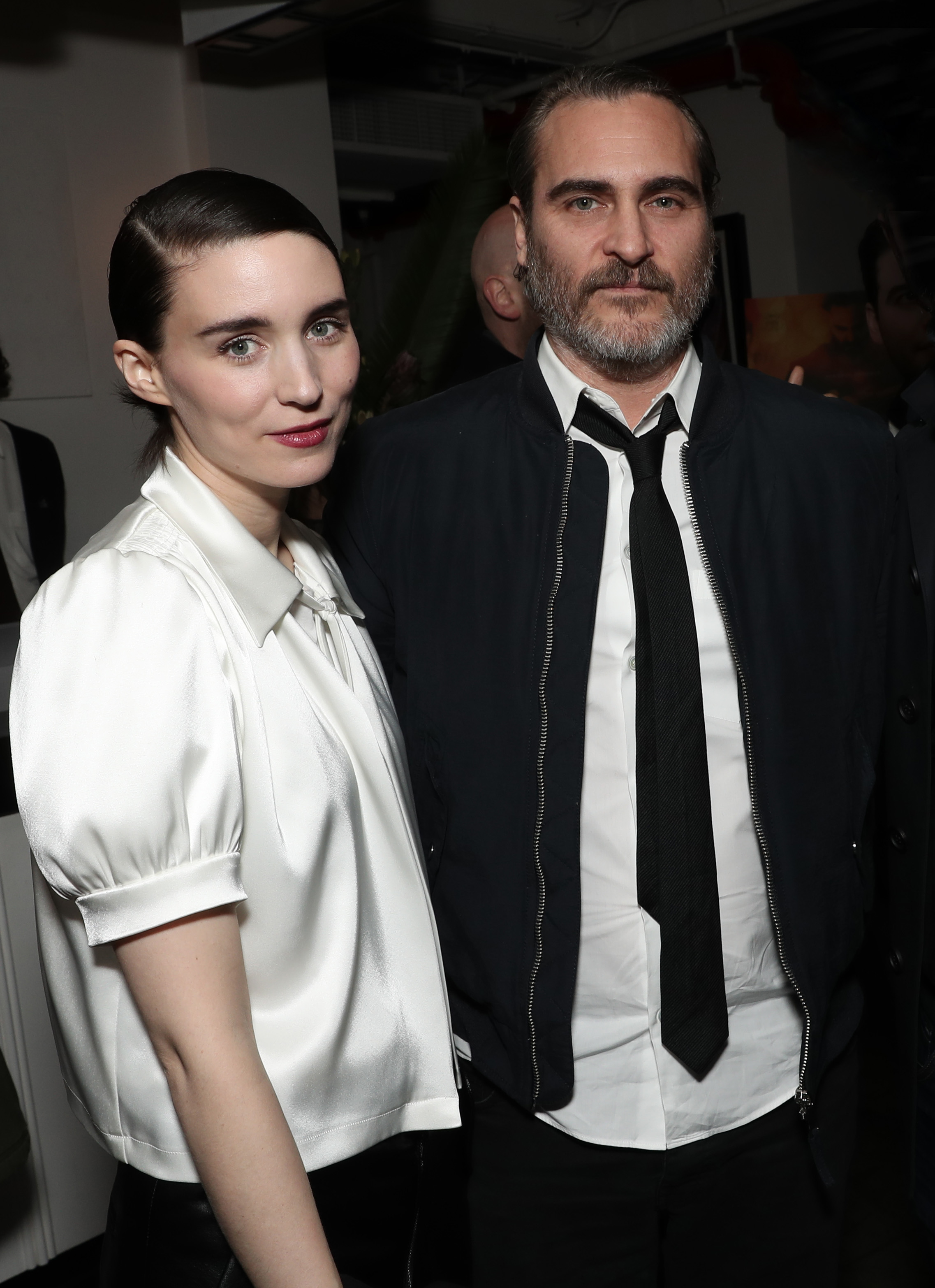 Joaquin Phoenix Wears a Suit With His Arm About Fiance Rooney Mara