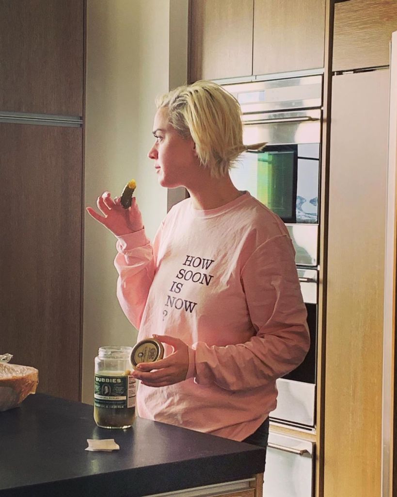 Katy Perry Pregnant Eats Pickles in Pink Sweatshirt