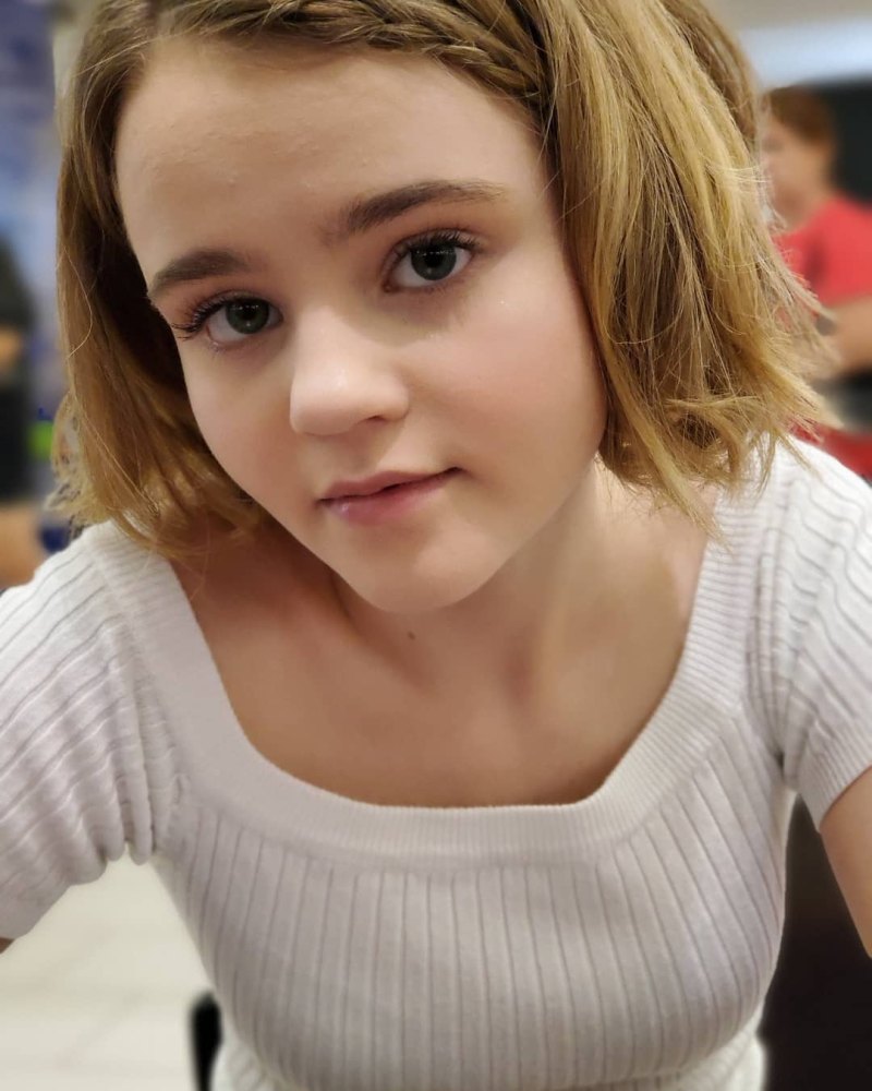 Megan Stott Wears White Sweater in Close up Selfie