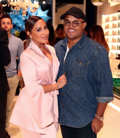 Adrienne Bailon Wears Pink Suit and Hugs Husband Israel Houghton in Jena Shirt and Black Hat