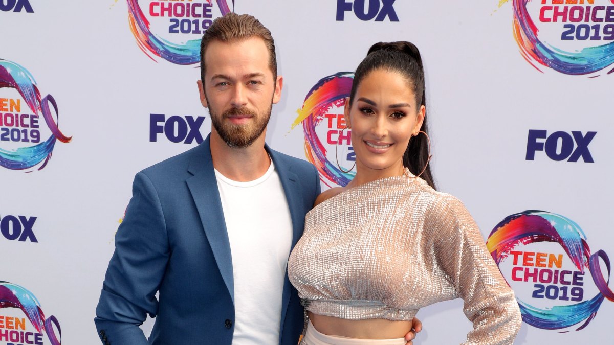 Nikki Bella Wears Sparkly Two Piece Outfit With Fiance Artem Chigvintsev in Blue Suit and White Tshirt