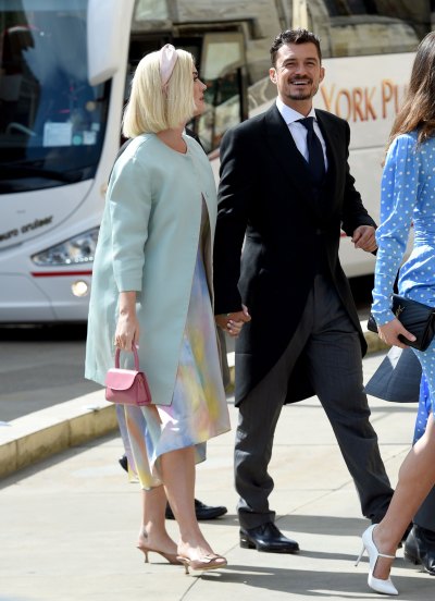 Katy Perry Wears Pastel Dress and Light Blue Overcoat With Orlando Bloom Black Suit
