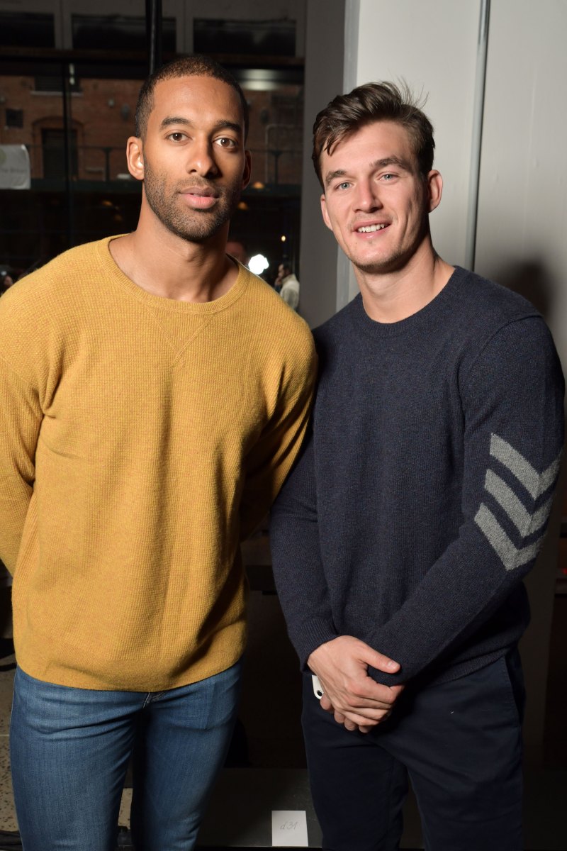 Bachelorette Contestant Tyler Cameron Blue Sweater Stands With Matt James in Yellow Sweater
