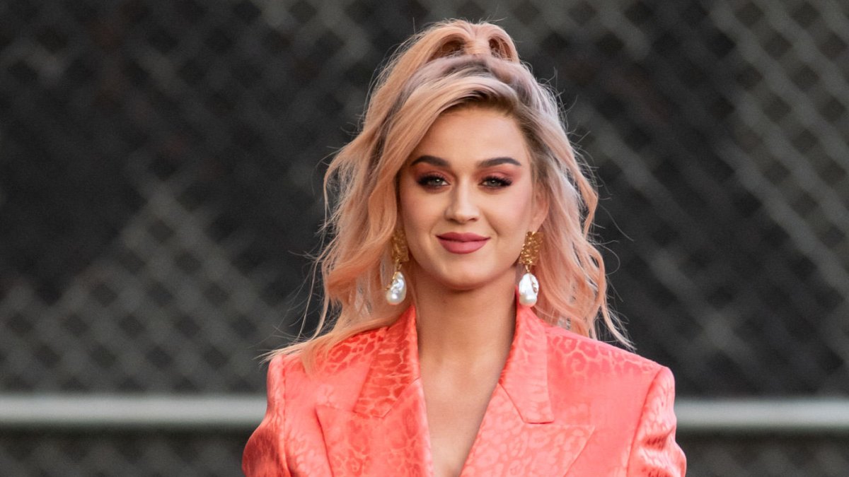 Katy Perry Wears Orange Suit With Hair in a Half Ponytail