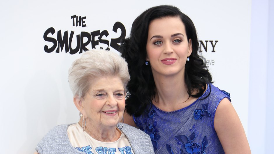 Katy Perry Smiles in Purple Dress and Black Hair While Holding Grandma Ann's Hand at Smurfs Premiere