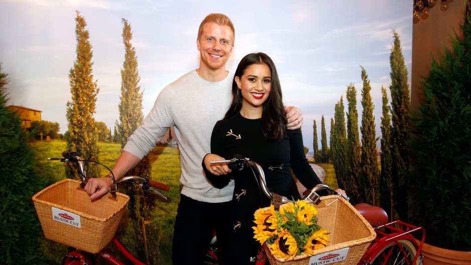 Bachelor Star Sean Lowe Smiles in Grey Sweater With Wife Catherine Holding Bikies