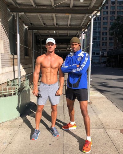 Shirtless Tyler Cameron Stands With Roommate Matt James in a Jacket and Shorts