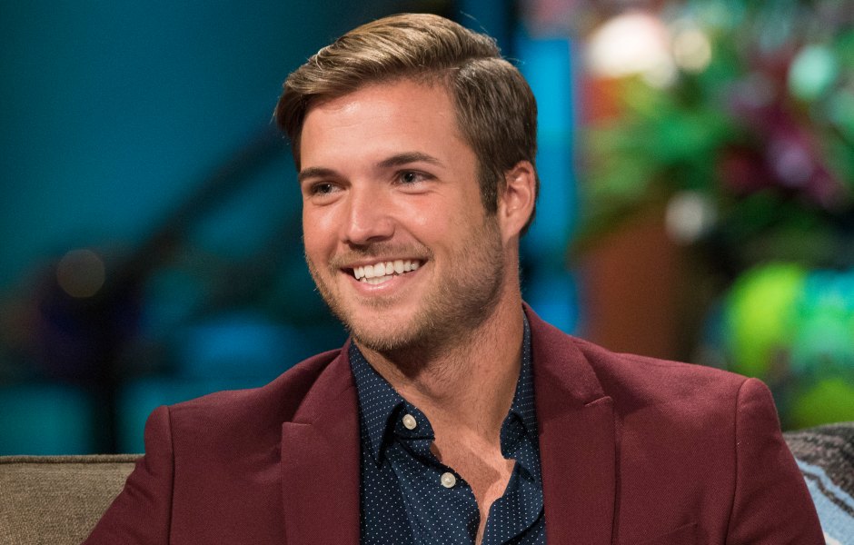 Bachelor in Paradise alum Jordan Kimball Wears Maroon Shirt and Blue Shirt While Smiling