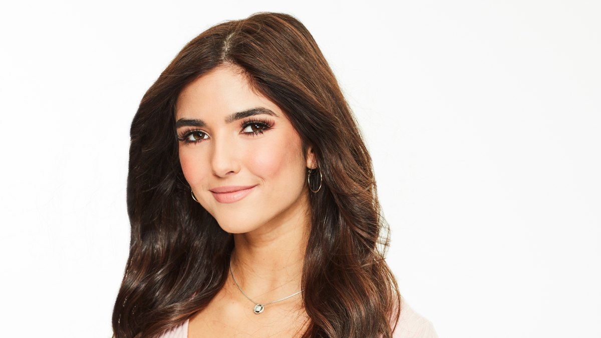Bachelor Listen to Your Heart Contestant Jamie Gabrielle Wears Pink Wrap Top and Jeans