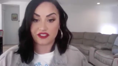 Demi Lovato Talks Over Facetime with Red Lipstick and Gold Hoop Earrings