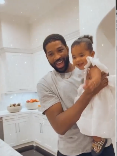 Tristan Thompson Laughs and Holds Daughter True in White Dress on Birthday