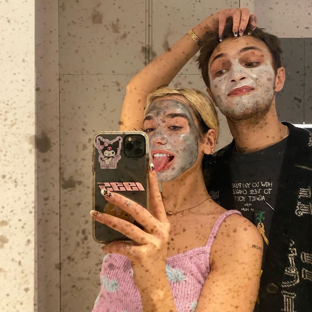 Dua Lipa Sticks Her Tongue Out Whiel Wearing a Face mask with Boyfriend Anwar Hadid