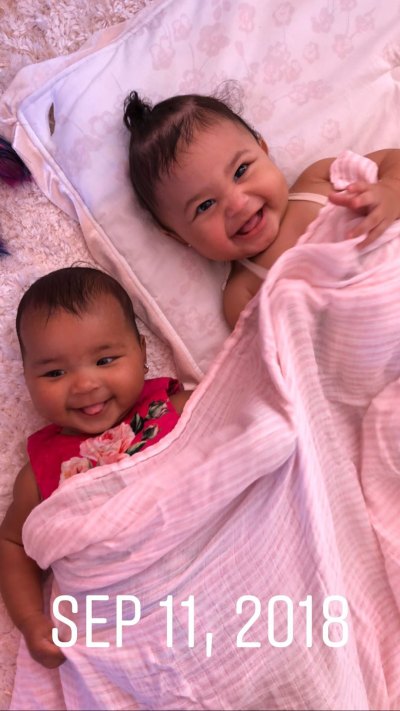 Stormi Webster and True Thompson Lay Under Pink Blanket and Giggle