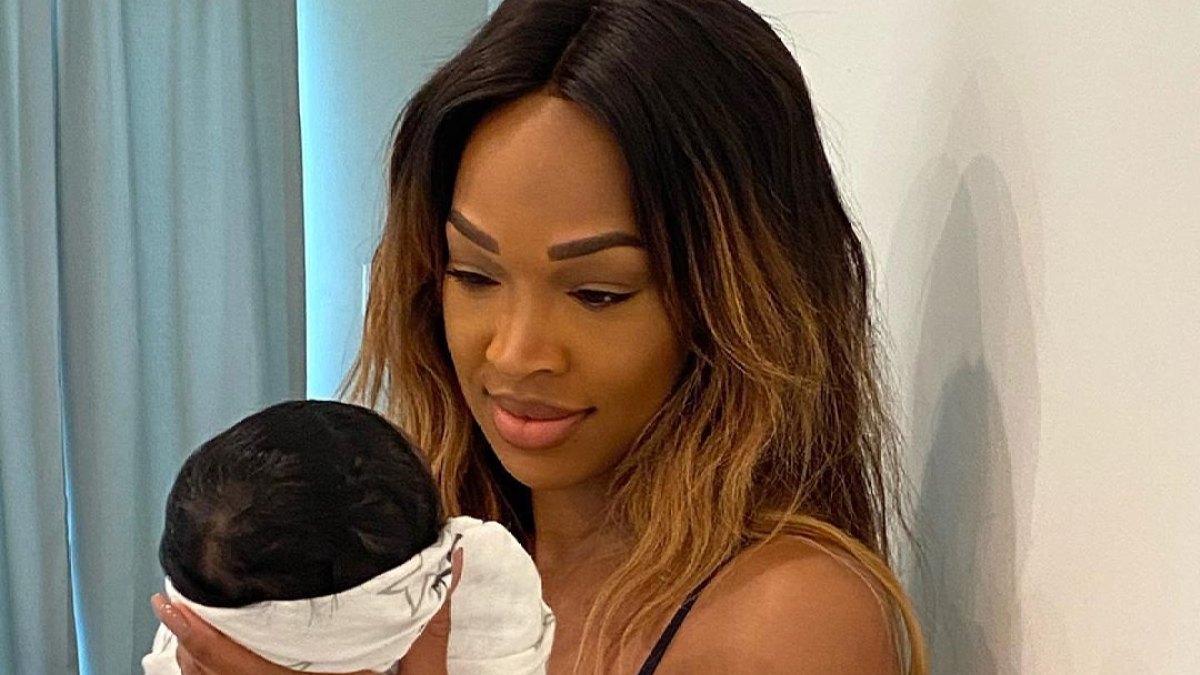 Malika Haqq Cradles Baby Ace