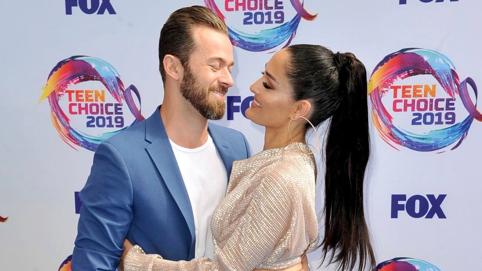 Nikki Bella Wears Sparkly Jumpsuit and Long Ponytail and Hugs Fiance Artem Chigvintsev in Blue Suit and Tshirt at Teen Choice Awards
