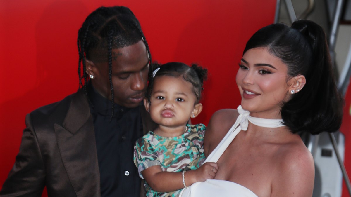 Travis Scott Snuggles Stormi Webster While Kylie Jenner Holds Her