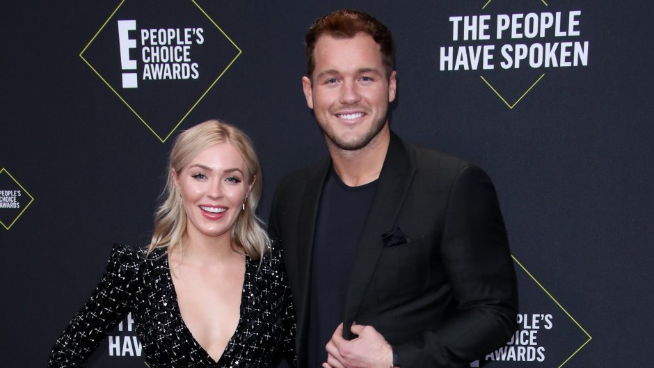Bachelor Colton Underwood Smiles in Black Suit With Arm Around Girlfriend Cassie Randolph in Black Wrap Dress