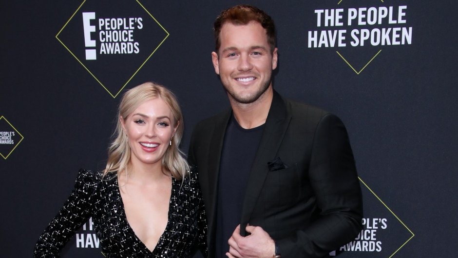 Bachelor Colton Underwood wears black suit on the red carpet with girlfriend cassie Underwood in a black wrap dress