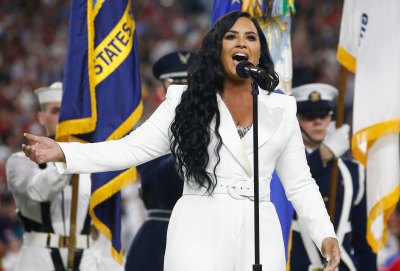 Demi Lovato Sings the National Anthem at the Super Bowl in a White Suit