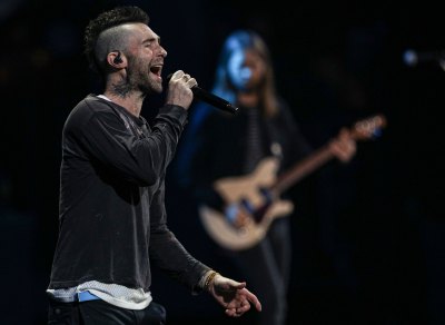 Adam Levine Sings on Stage Wearing Sweater