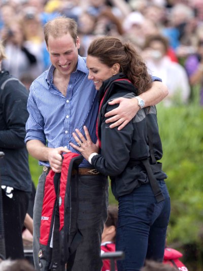 Prince William Hugs Kate Middleton While Wet as They Both Laugh