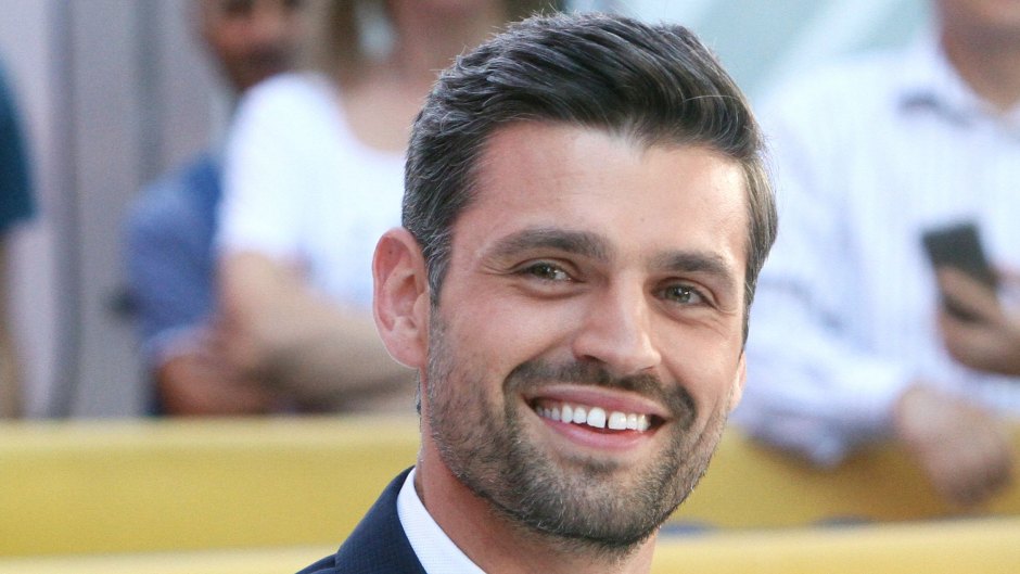 Bachelorette Contestant Peter Kraus Smiles in a Suit