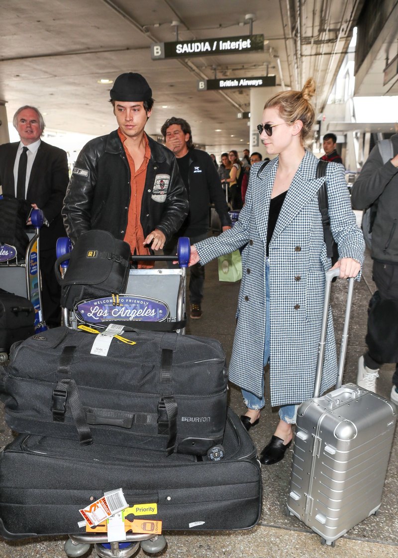 Cole Sprouse Wears Black Beanie at Airport With Lili Reinhart